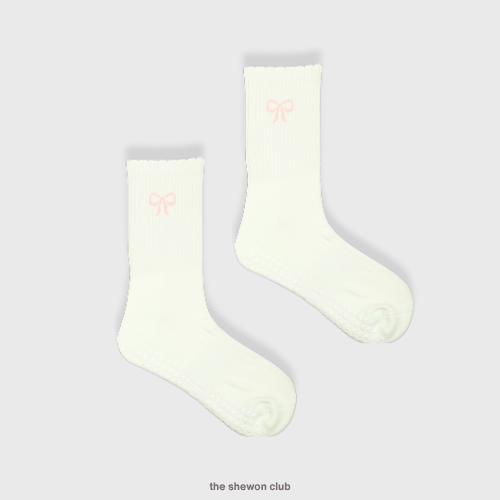 Light beige Pilates crew grip socks with pink bow