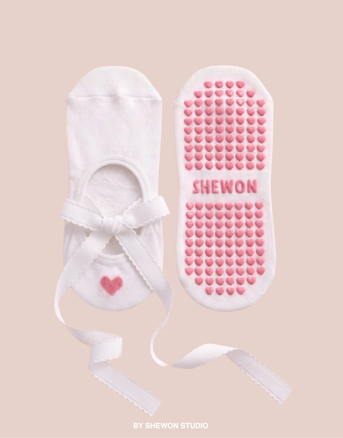 White and pink ballet Pilates grip socks with long straps